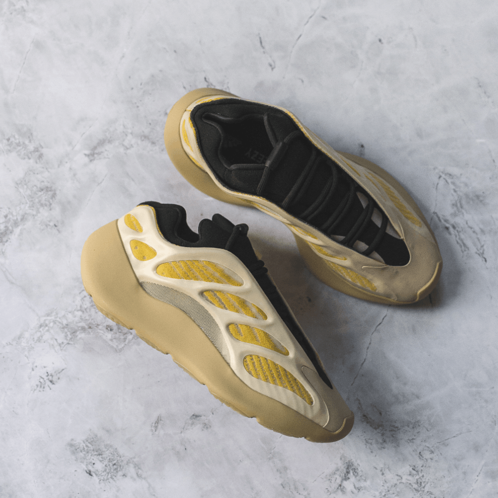 black and gold yeezy 700